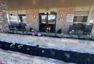 Front porch with flowers at Castle Hills Rehabilitation & Care Center