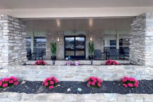 Front outdoor view with flower beds at Castle Hills Rehab & Care Center