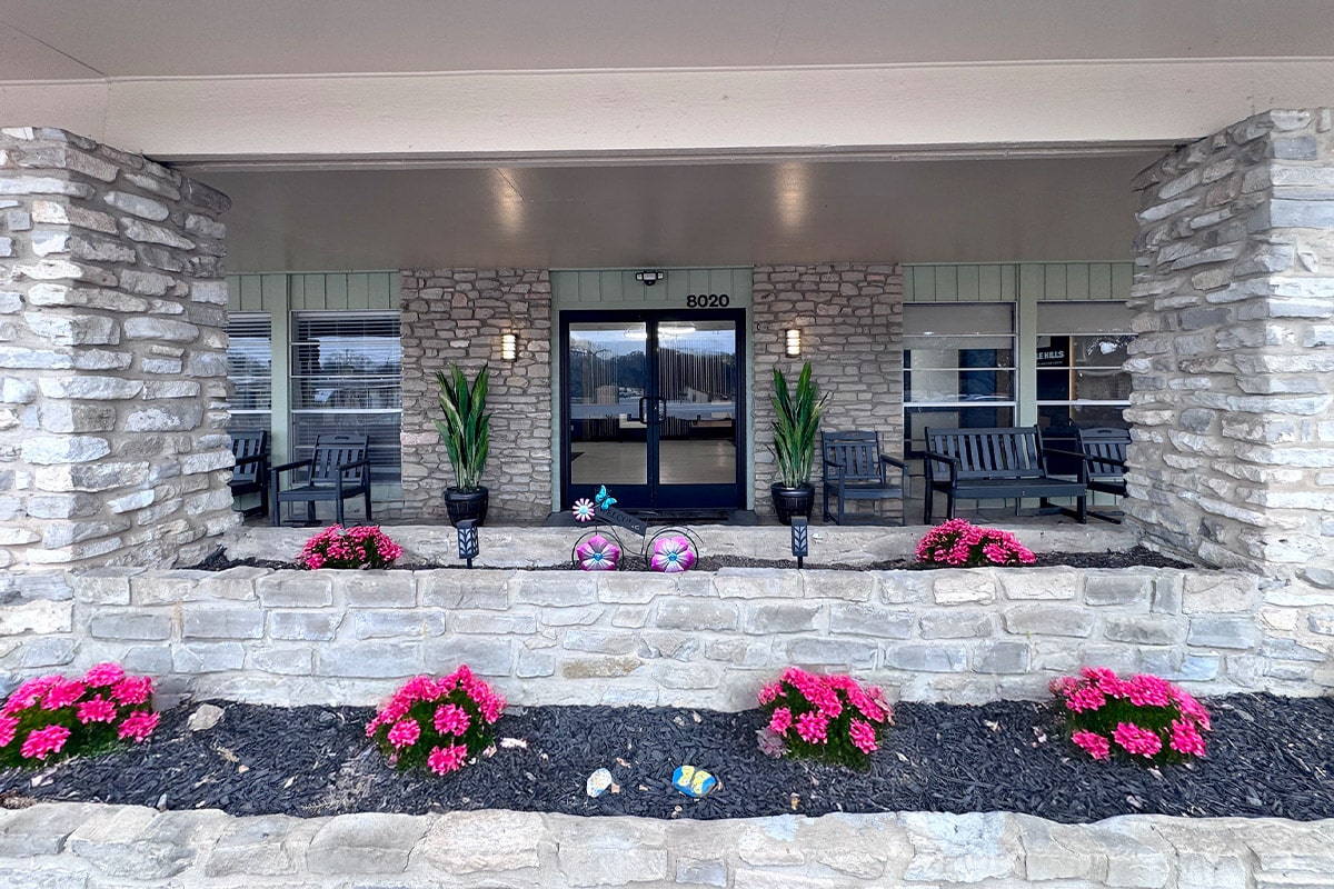 Front outdoor view with flower beds at Castle Hills Rehab & Care Center